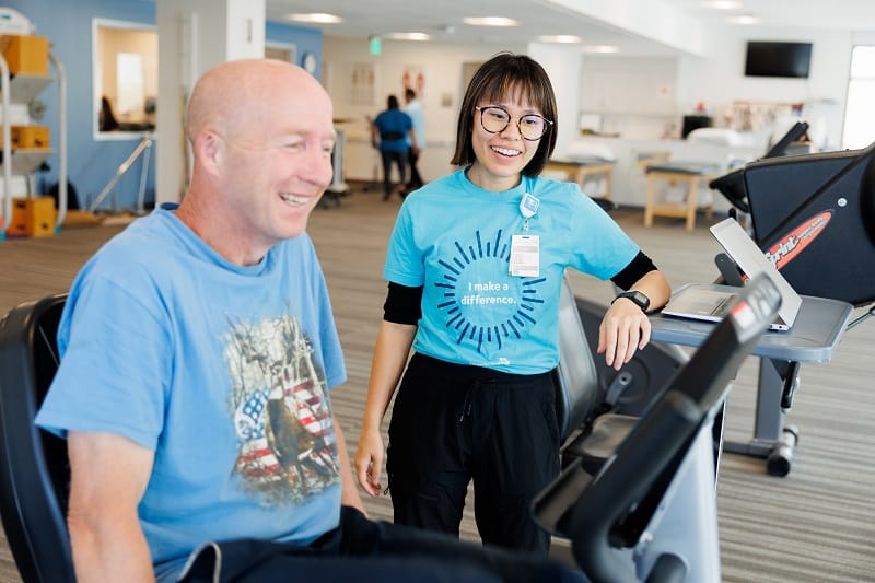 A physical therapist works with a patient.